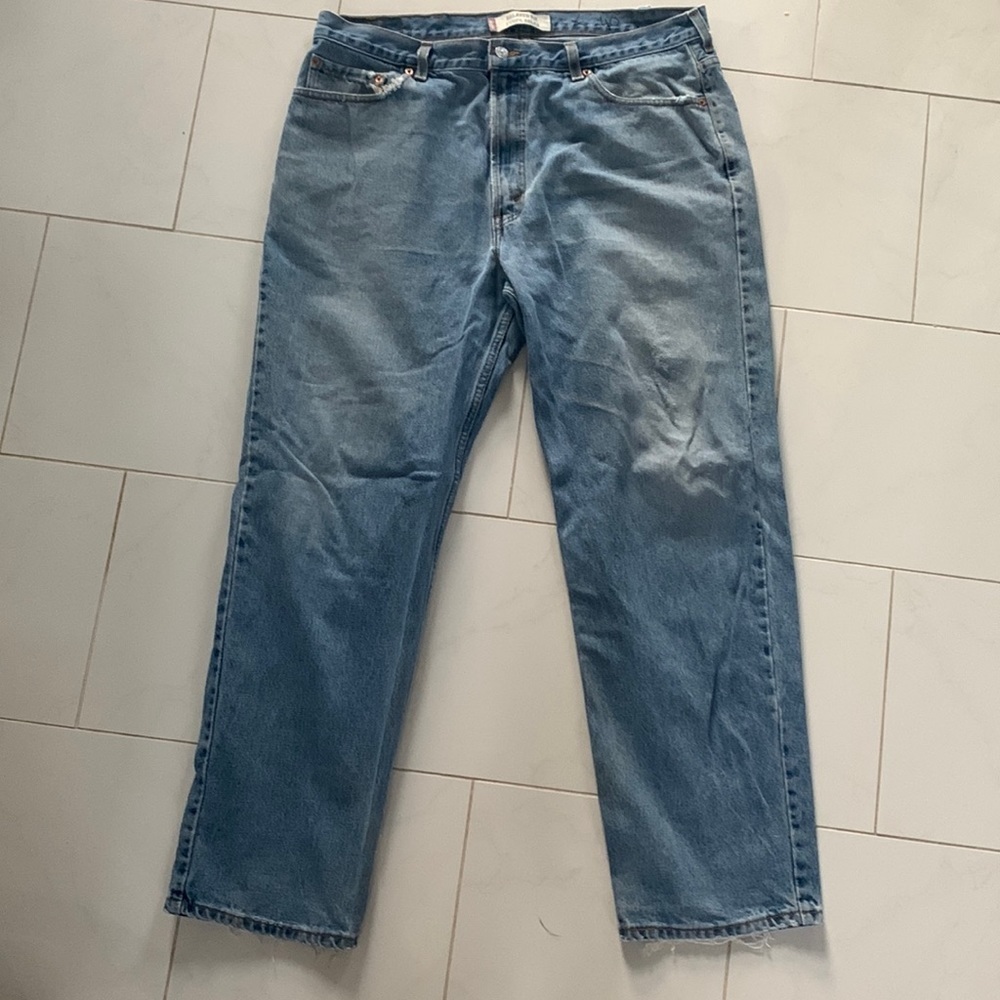 Levi’s relaxed fit blue jeans, size 40. Authentically distressed / Preloved!